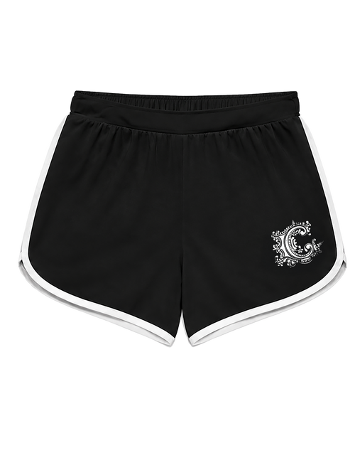 Black athletic shorts with white piping along the edges and a white circular graphic logo on the lower left leg, displayed against a solid white background.